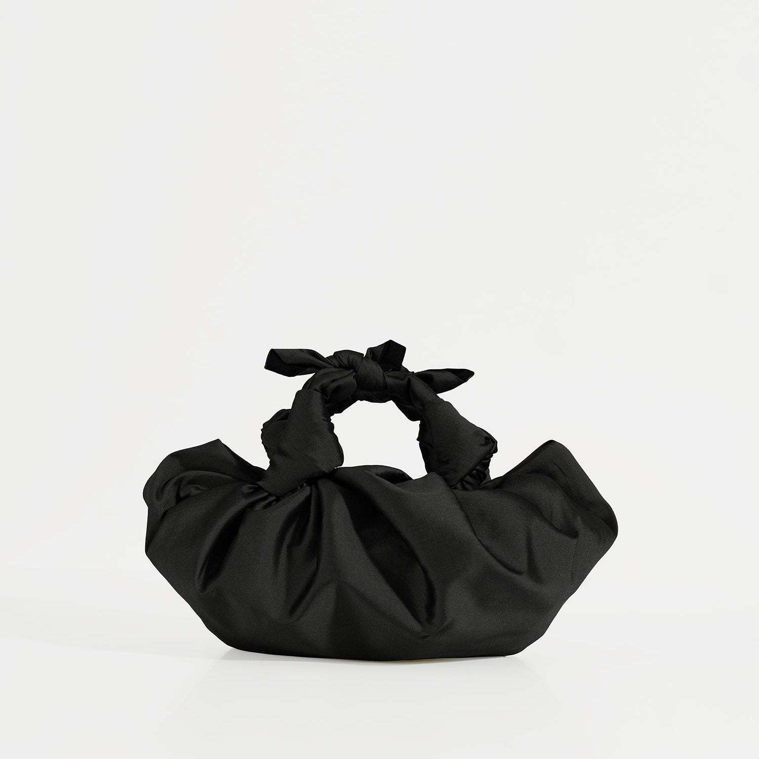 A black silk knotted bag with hand-knotted top handles, displayed against a white background.